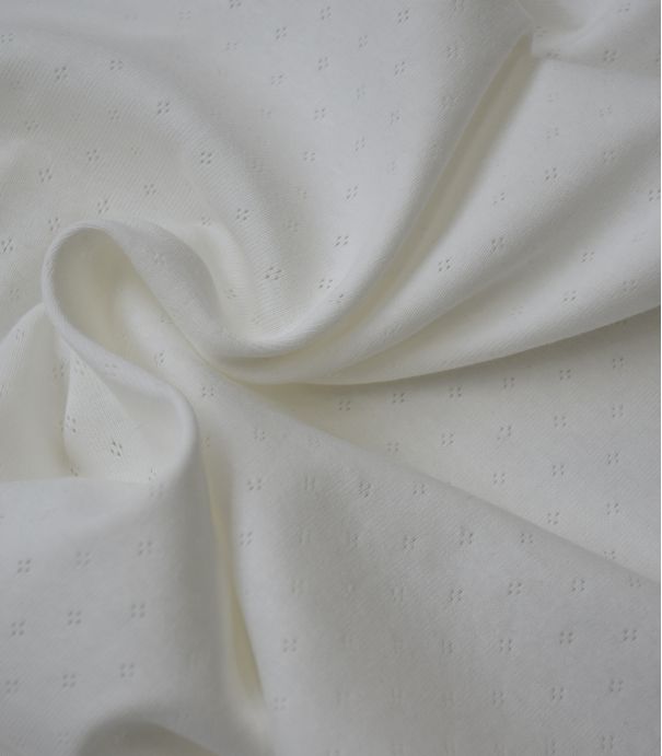 Tissu jersey ajouré - Ecru Tissu jersey ajouré - Ecru