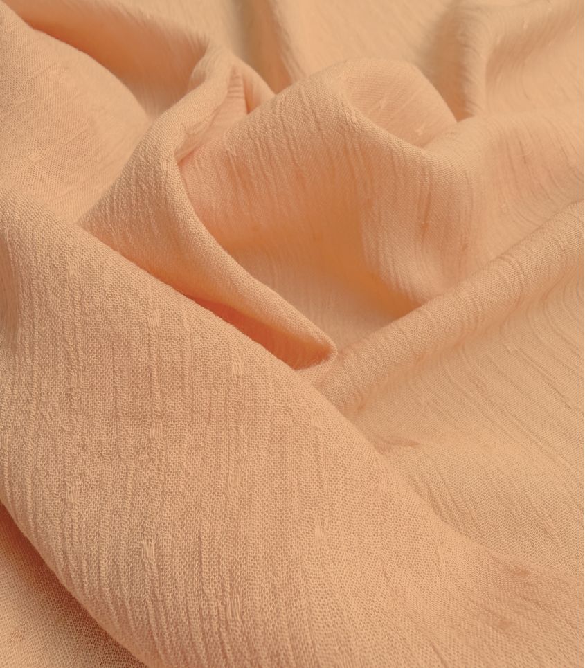 Tissu viscose plumetis crinkle - Pêche Tissu viscose plumetis crinkle - Pêche