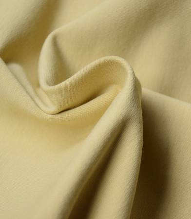 Tissu bio French terry - Dusty yellow Tissu bio French terry - Dusty yellow